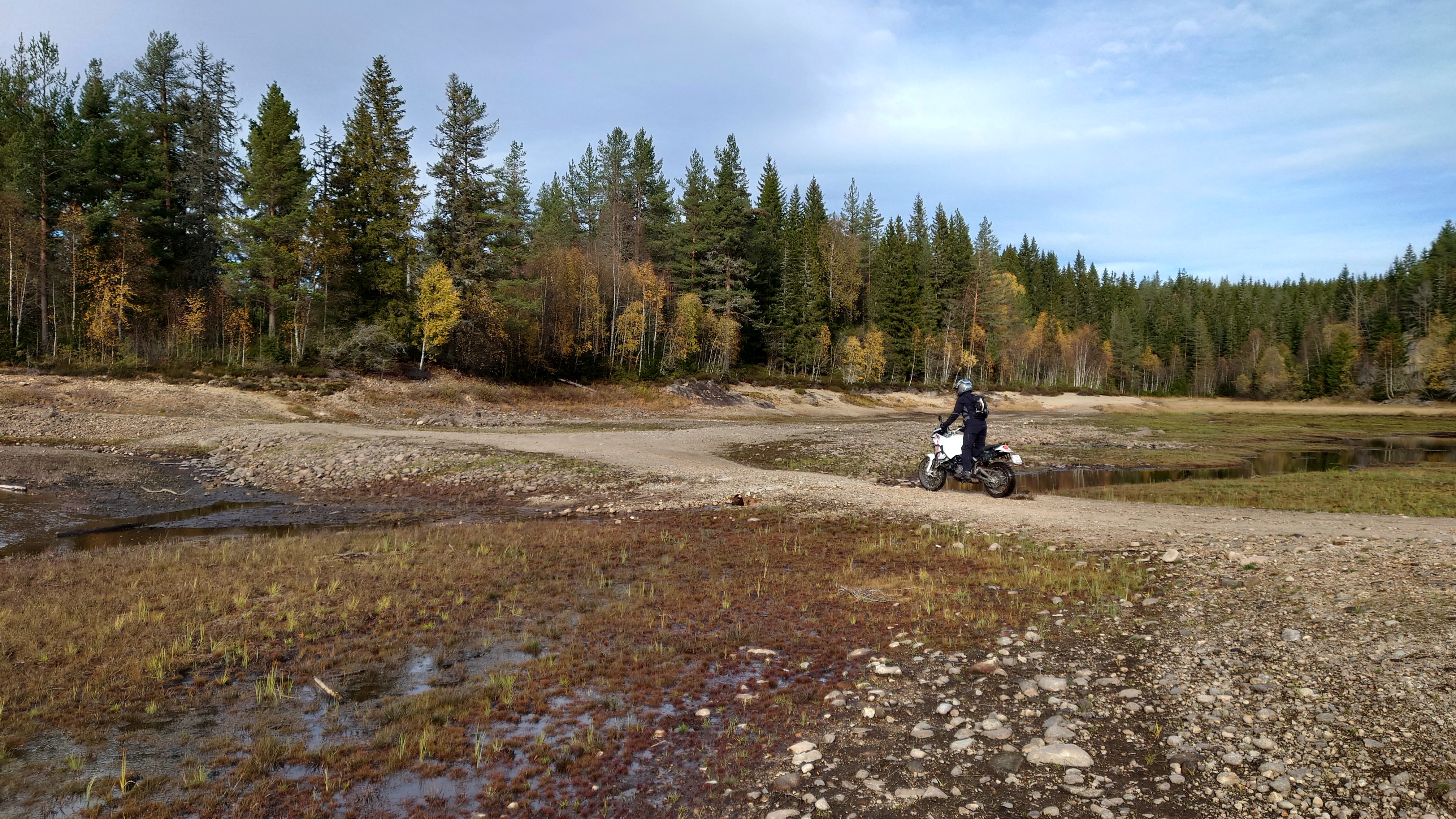 Kim riding on the riverbed